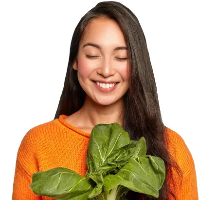 Smiling girl with vegetables